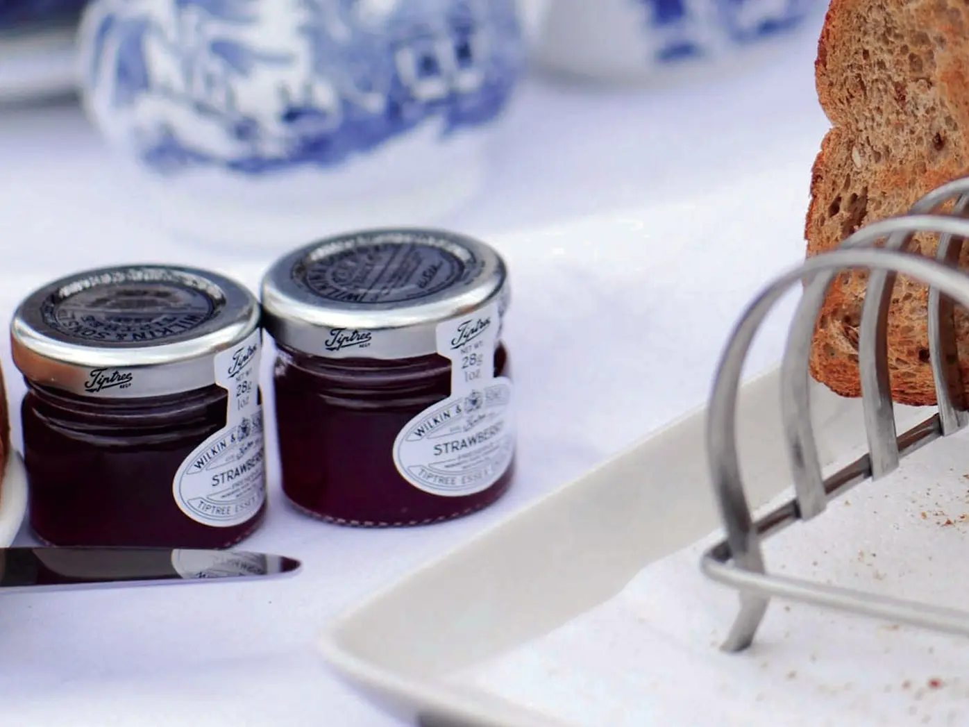 two glass jars near toasted bread